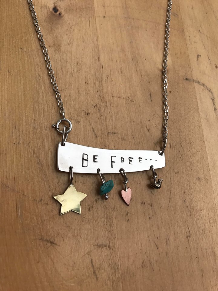 Silver ‘Be Free’ necklace - with brass , copper , bronze and turquoise charms.