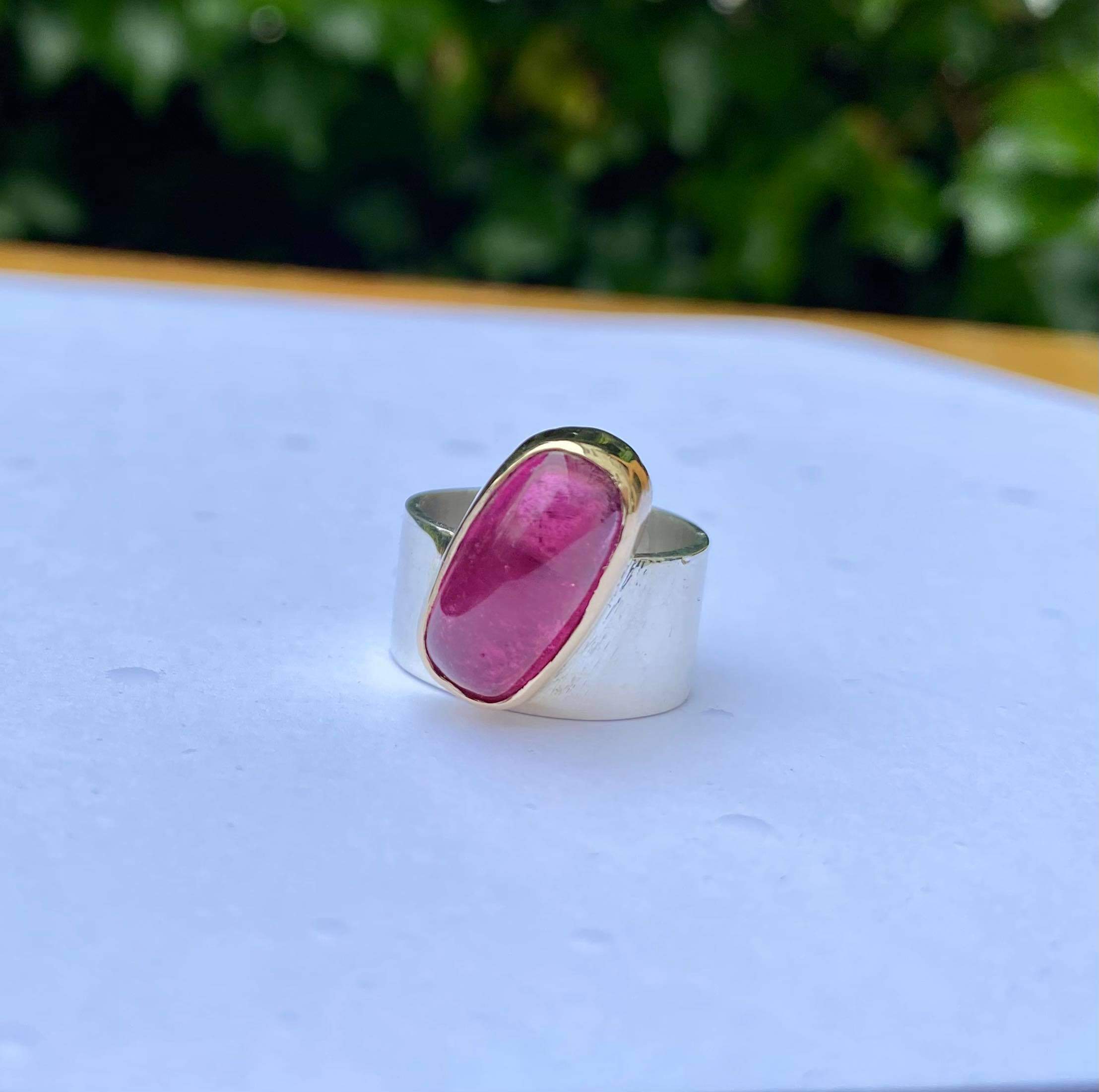 SILVER 10MM BAND WITH PINK TOURMALINE CABOCHON IN YELLOW GOLD
